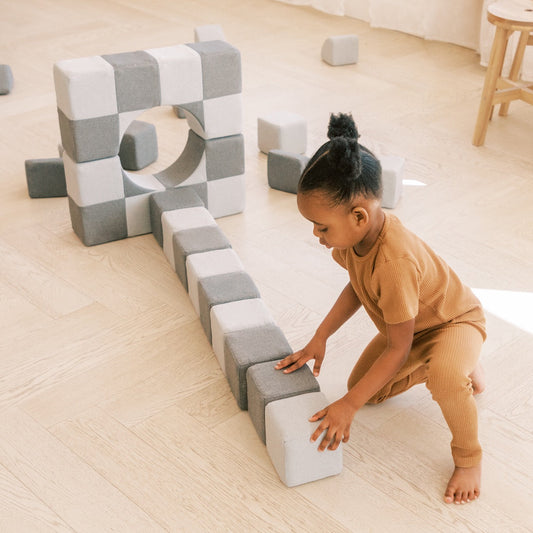 A young girl plays with MagnetBlox.